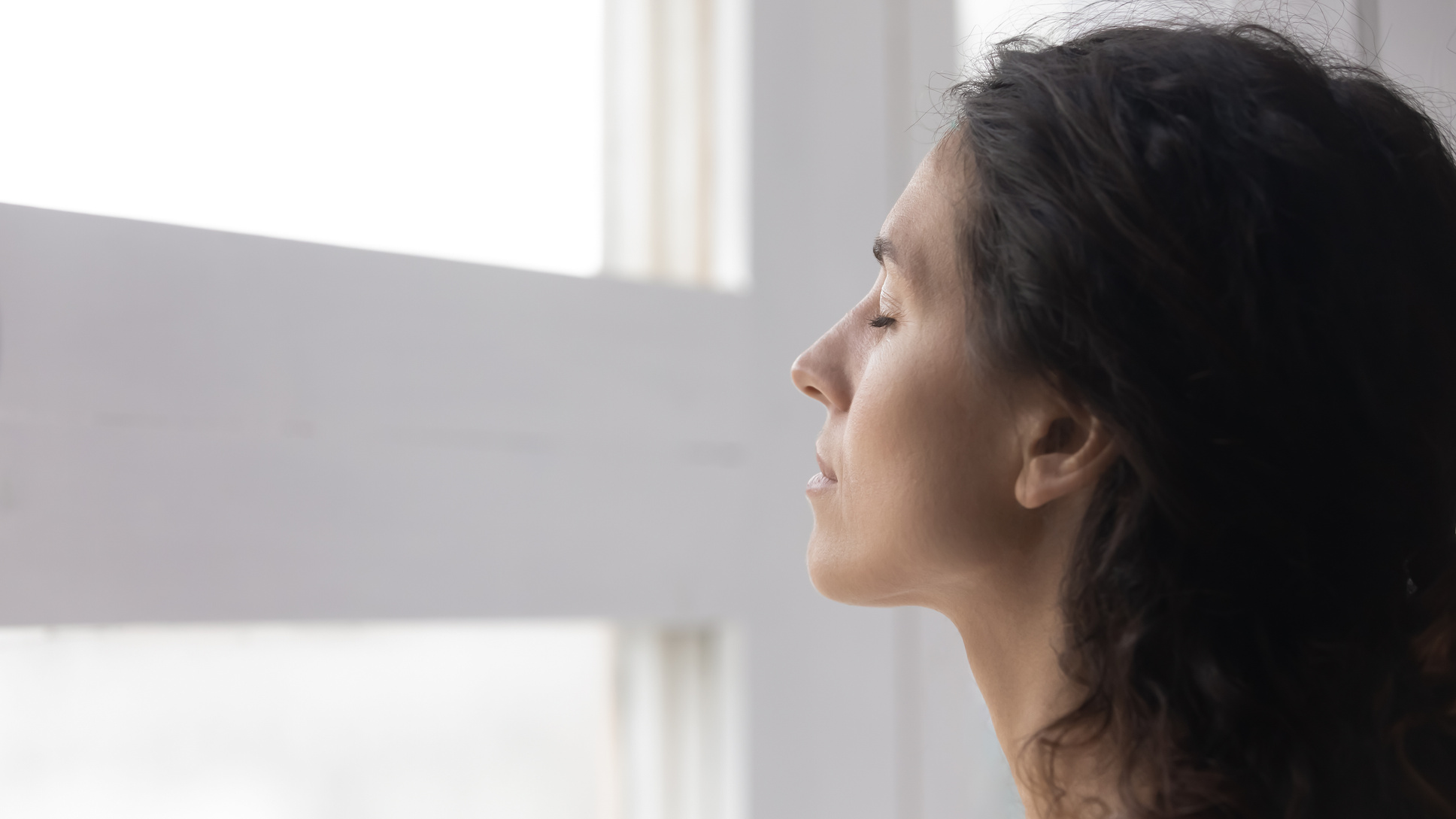 Close up mindful thoughtful woman with closed eyes meditating