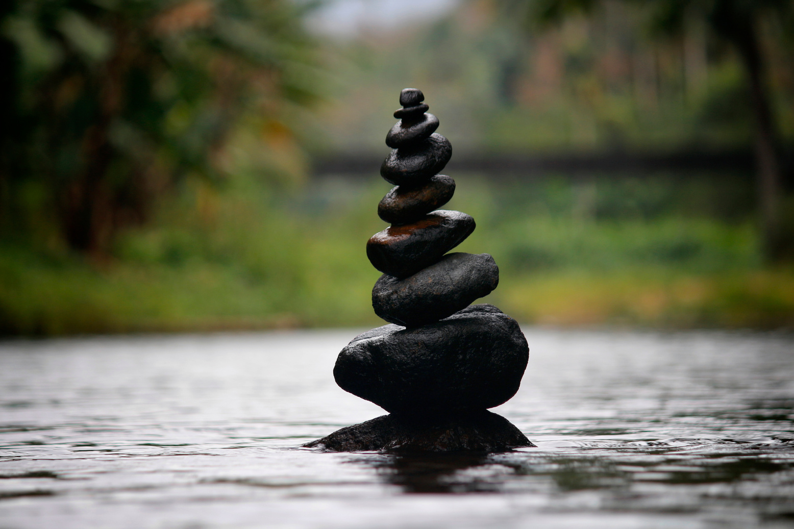 Black Stackable Stone Decor at the Body of Water